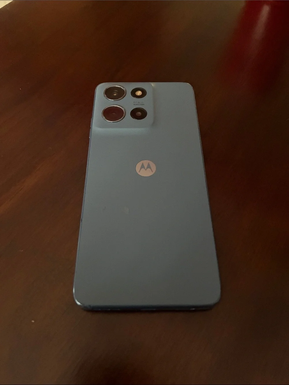 Motorola bluish grey Smartphone with Dark Teal Display